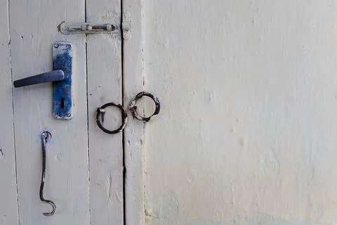 Exploring the rustic charm of an old door handle with a unique design refle.. Stock Photos