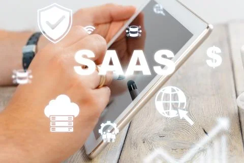 Exploring Saas options on a tablet with icons representing cloud technology and Stock Photos