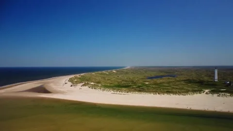 Exploring the sandy beach and clear waters at the shoreline during a bright.. Stock Footage 339940400