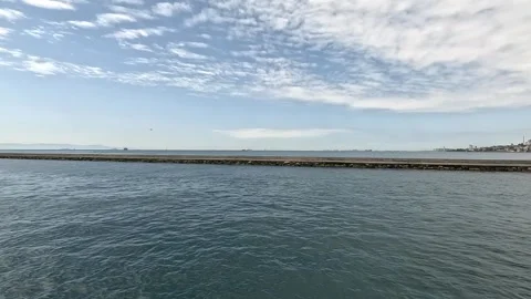 Exploring the sea horizons: a view of the pier from the ferry deck Stock Footage 274633142