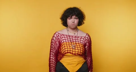 Exploring self-expression through fashion and emotions in a striking yellow.. Stock Footage 313273723