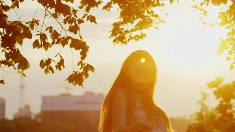 Exploring Sensuality and Confidence through Dance in the Glowing Cityscape Stock Footage 242666154