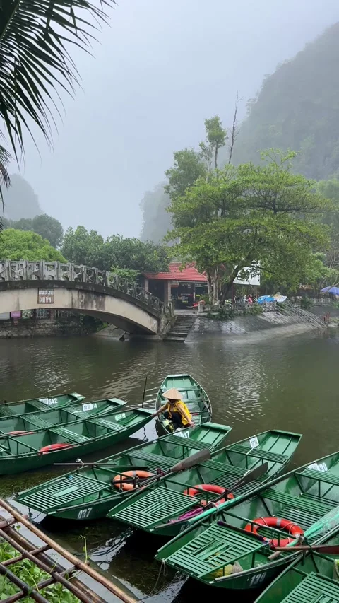 Exploring the serene waters of Vietnamese countryside, Vietnam on a misty Stock-Footage 302264355