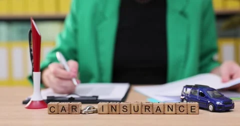 Exploring the steps of completing car insurance paperwork in a bright office Video stock 319642384