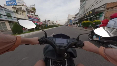 Exploring the streets on a scooter in a bustling city atmosphere Video stock 308025375