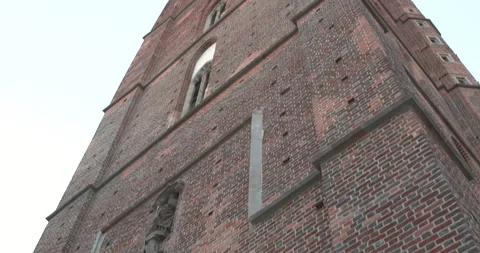 Exploring the stunning architecture of a historic brick tower at sunset in a Video stock 283794712
