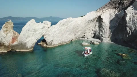 Exploring a stunning coastal rock formation and clear turquoise waters Stock Footage 301735272