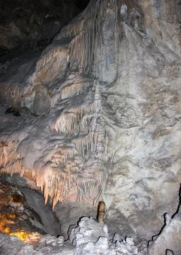 Exploring the stunning formations of an underground cave in the heart of natu Stock Photos