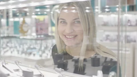 Exploring stunning gold, silver, and diamond jewelry in a store Stock-Footage 313118567