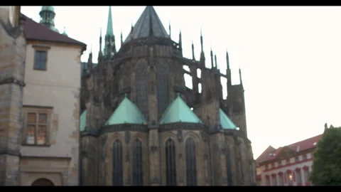 Exploring the stunning Gothic architecture of St. Vitus Cathedral at sunset in Video stock 283795489