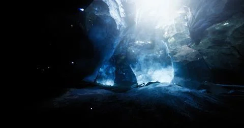 Exploring a stunning ice cave with vibrant blue light and rocky formations Stock Illustration