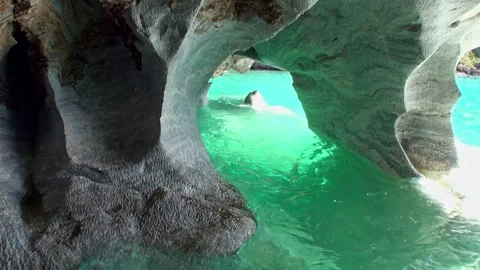 Exploring the stunning marble caves of lago general carrera Stock Footage 314300137
