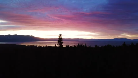 Exploring the sunset of Lake Tahoe thru a Drones view Stock Footage 303652968