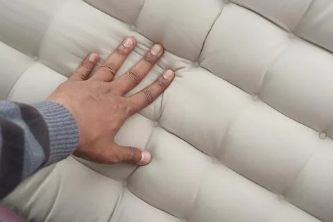 Exploring the texture of a soft, inviting cushion surface Stock Photos