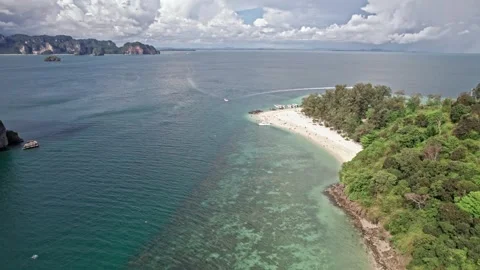 Exploring Thailand's serene beaches and vibrant oceans from above Video stock 310560233