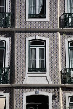 Exploring the tile-covered facades of Lisbon buildings in street view Stock Photos