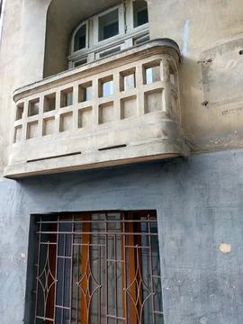 Exploring the Timeless Charm of an Old Stone Balcony in a Quaint Urban Neig.. Stock Photos