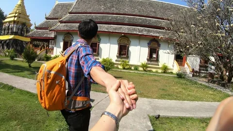 Exploring Together in a Beautiful Garden Setting Stock Footage 314450253