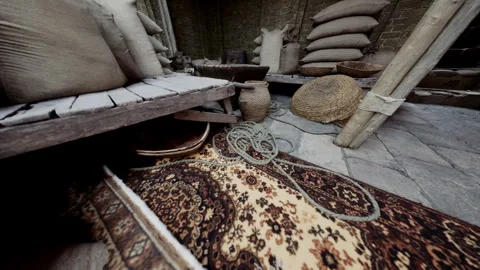 Exploring a Traditional Workspace Filled With Antique Rugs and Tools Stock Footage 348159903