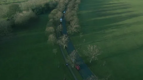 Exploring the tranquil beauty of Harrogate's trees and winding paths in a serene Stock Footage 296852941