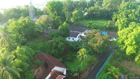 Exploring the tranquil beauty of a secluded hamlet surrounded by a rich tap.. Stock Footage 337284435