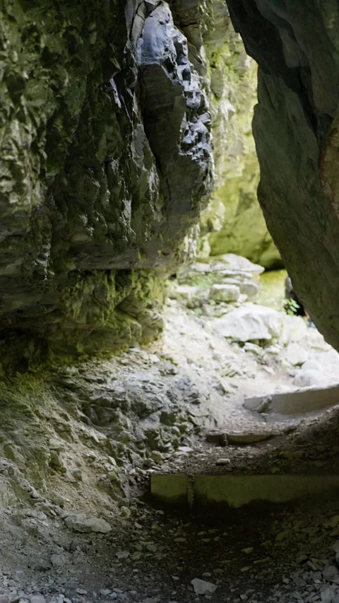 Exploring a Tranquil Cave Landscape Surrounded by the Majestic Beauty of Nature Stock Footage 316819279