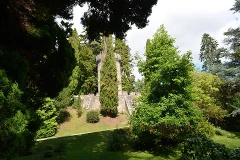 Exploring the Tranquil Gardens of an Ancient Stone Structure Stock Photos