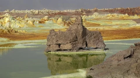 Exploring the unique landscape of Danakil Depression in Ethiopia at an acid lake Video stock 340388936