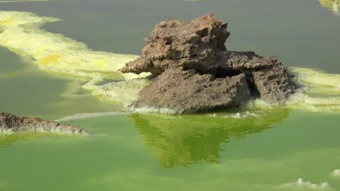 Exploring the unique landscape of Danakil Depression in Ethiopia at an acid lake Video stock 340388937