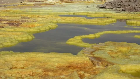 Exploring the unique landscape of Danakil Depression in Ethiopia at an acid lake Video stock 340388949
