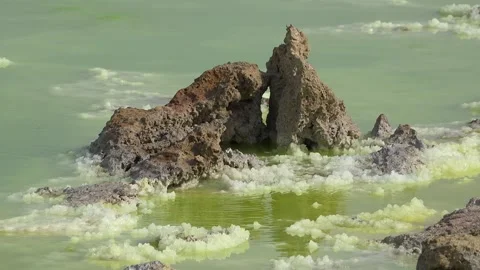 Exploring the unique landscape of Danakil Depression in Ethiopia at an acid lake Video stock 340388963