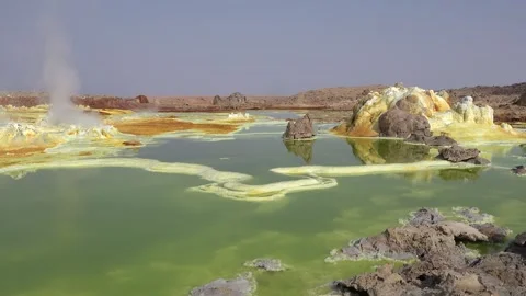 Exploring the unique landscape of Danakil Depression in Ethiopia at an acid lake Video stock 340388964