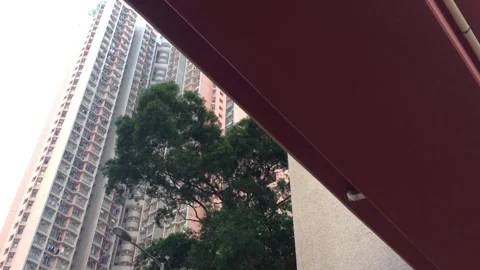 Exploring urban architecture under a dramatic sky Stock Footage 323700730