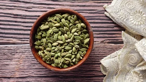 Exploring the uses of green cardamom spice Stock Footage 344723227