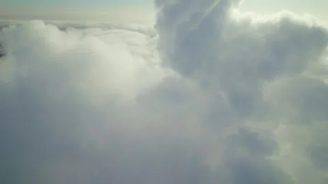 Exploring vast cloud formations above the landscape during a calm afternoon sky Video stock 312855151