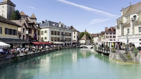 Exploring the vibrant atmosphere along the canals of Annecy Stock Footage 303709403