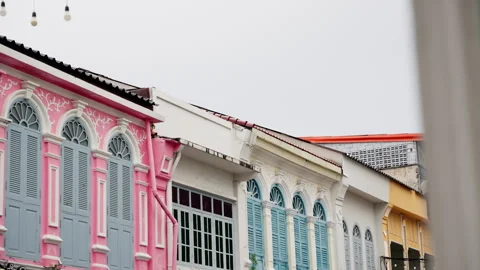 Exploring Vibrant Colonial Architecture: A Study of Colorful Shophouses Stock Footage 310154978