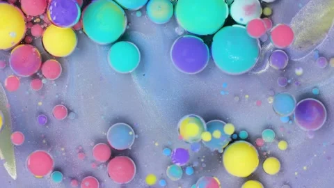 Exploring vibrant colors and patterns in microscopic particles over a flowing Stock Footage 288624297