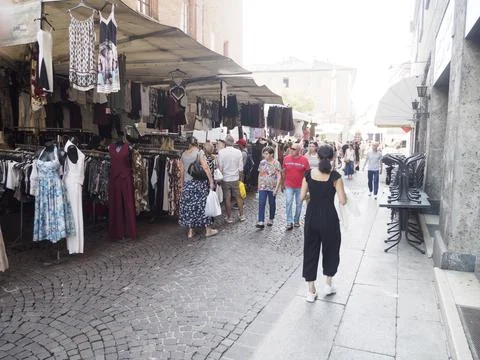 Exploring a Vibrant Open Air Bazaar Showcasing Diverse Apparel Selections in  Stock Photos
