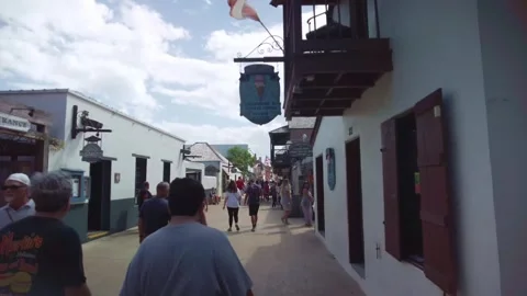 Exploring the vibrant pedestrian strip in St. Augustine, Florida, where Stock Footage 332818900