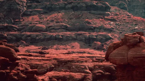 Exploring a Vibrant Red Landscape Full of Unique Rock Formations Stock Footage 346688958