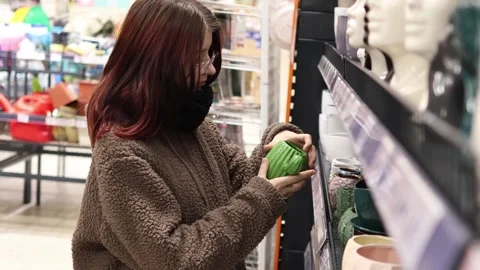 Exploring a vibrant store filled with unique decorative pieces and ceramics Stock-Footage 296145255