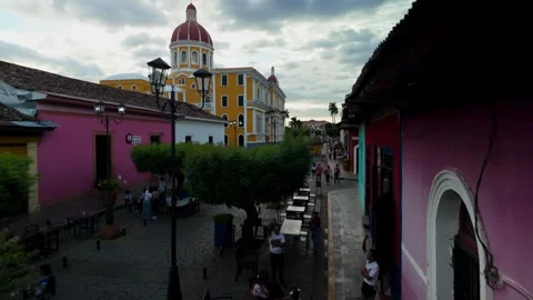 Exploring the Vibrant Streets of Granada With Its Stunning Cathedral Backdrop Stock Footage 305523677