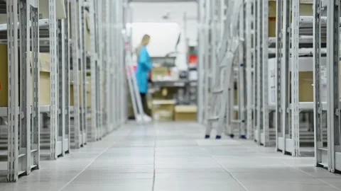 Exploring warehouse environment with workers organizing inventory efficiently Stock Footage 283895004