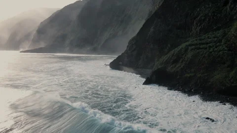 Exploring waves against madeira's stunning atlantic ocean rock formations Stock Footage 321520705