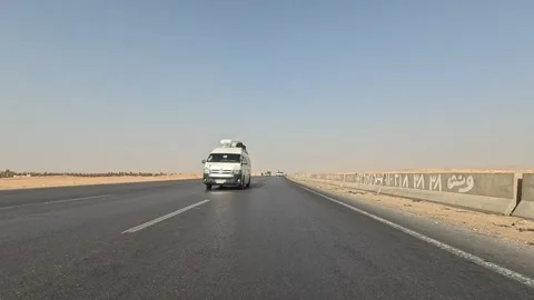 Exploring wide desert scenery along Cairo Fayoum Desert Road during smooth drive Video stock 329838553