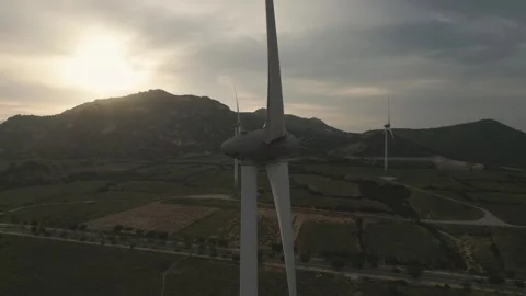 Exploring a wind farm at sunset in a mountainous landscape 스톡 동영상 309426073