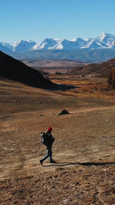 Exploring a winding trail in a mountainous area during autumn's calm afternoon Stock Footage 308951288