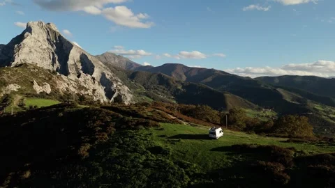 Exploring the world with campervan, Picos de Europa in Spain, aerial orbit view Stock Footage 294699150