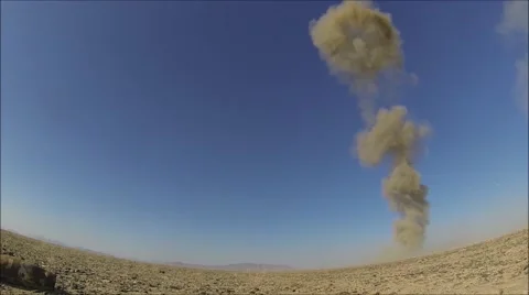 Explosion by Air Force Explosive Ordnance Disposal technicians Stock Footage 40710996